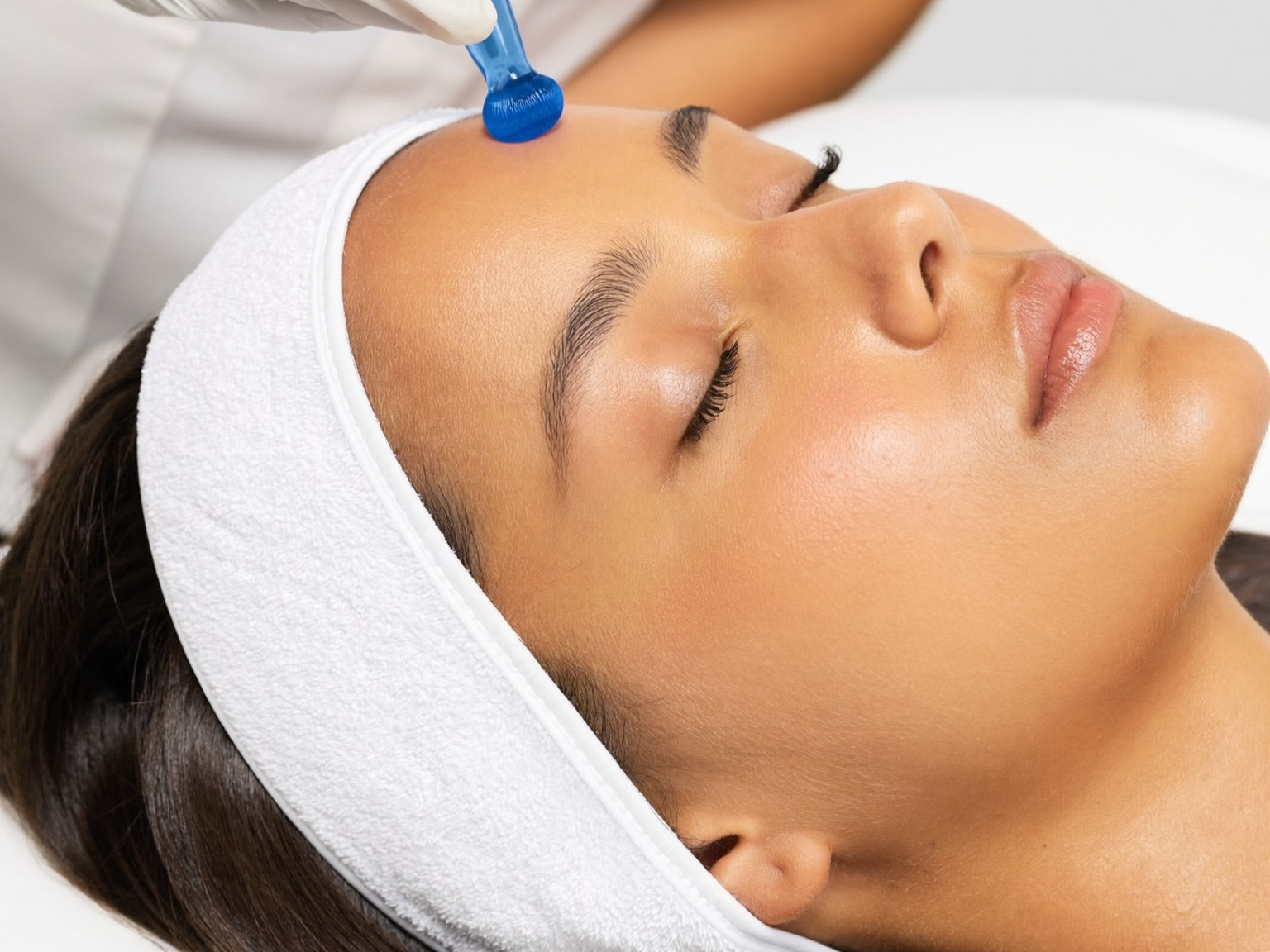 Hands-on manual facial massage treatment being performed