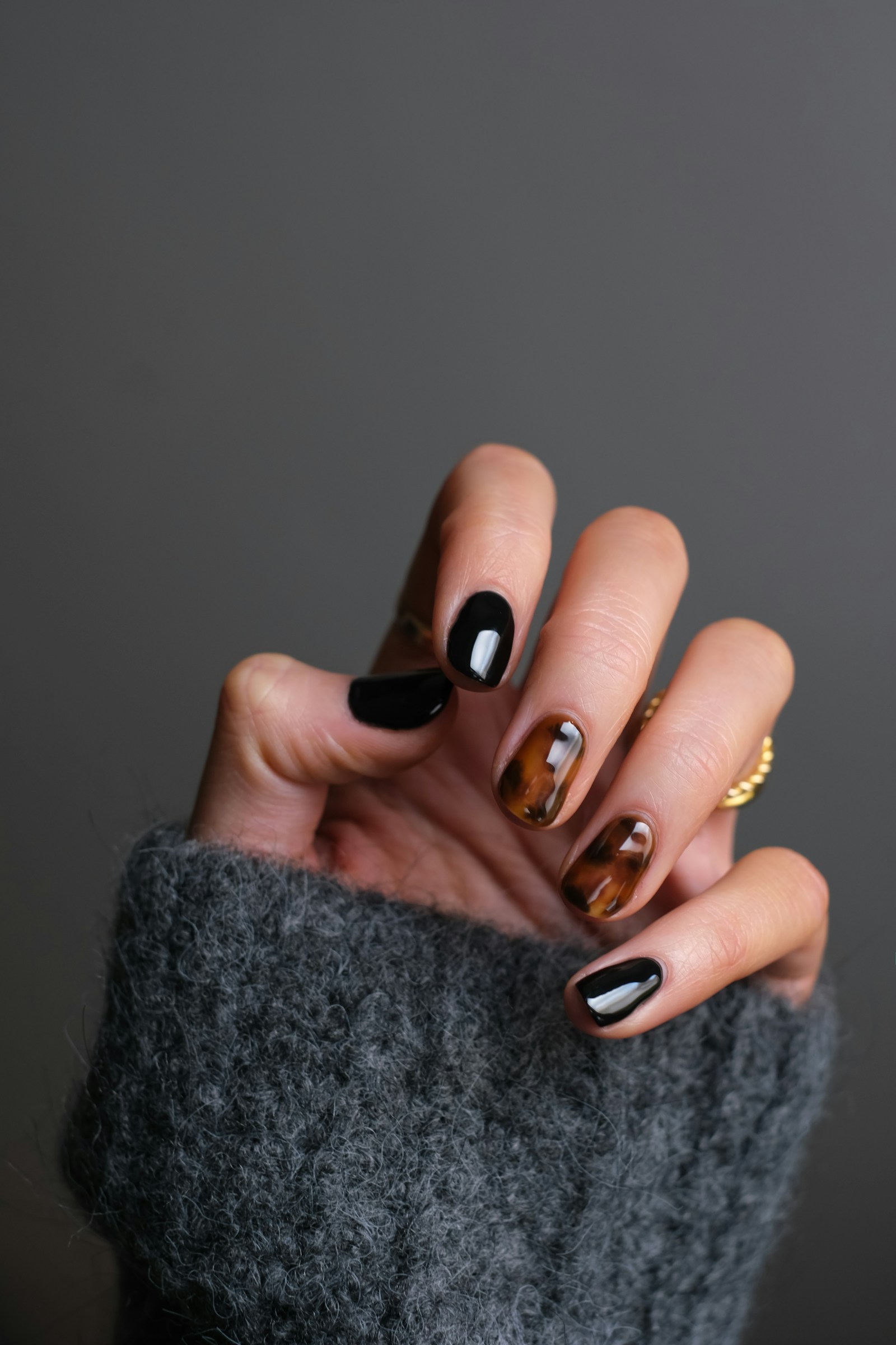 Dark-polish manicure showcasing professional nail finishing
